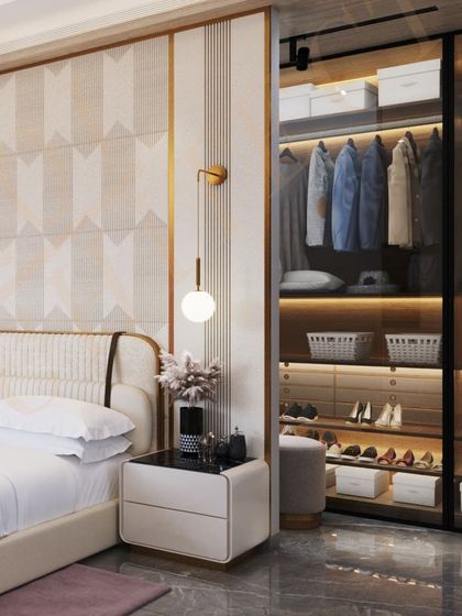 This view showcases the seamlessly integrated walk-in wardrobe with glass doors, offering a stylish and practical storage solution.