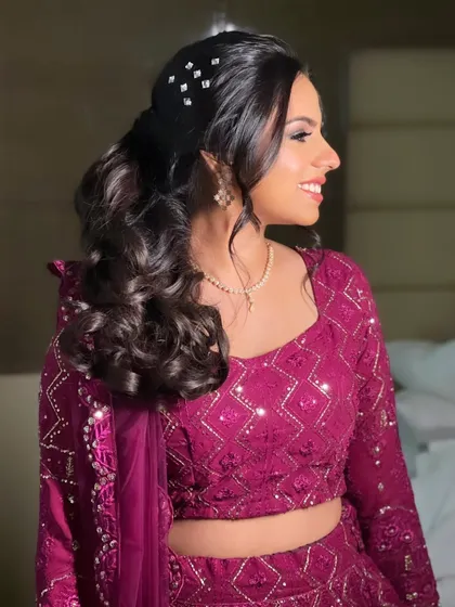 A side view of the Sangeet ponytail, showing its soft texture and sparkling accessories.
