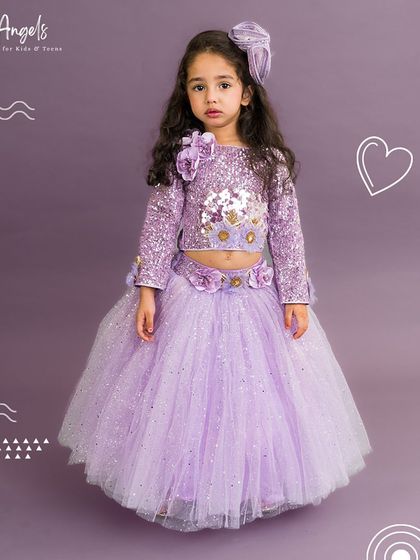 This full view of the lilac shimmer lehenga shows the sparkling fabric and comfortable crop top design.
