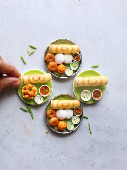 A beautiful arrangement of South Indian breakfast platters, perfect for a foodie-themed gift.
