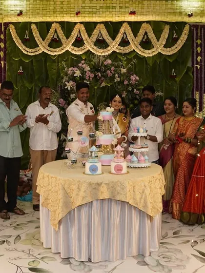 A joyous family moment at a baby shower, with our dessert table and sparklers adding to the celebration.