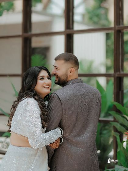 A happy, candid moment from a ring ceremony. The natural smiles and loving glances are what make these event photos so special.
