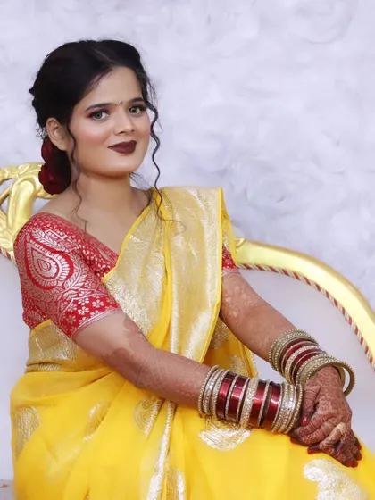 A graceful seated portrait of the bride, showcasing her complete look.