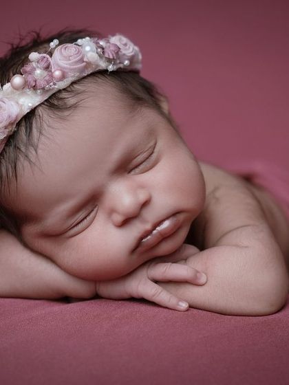 Cuteness overload. This close-up on a sleeping baby's face, with their pouty lips and soft cheeks, is simply irresistible.