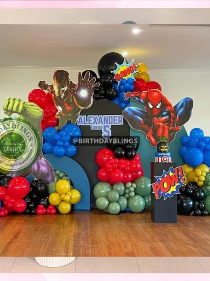 A massive Avengers-themed balloon sculpture, featuring character cutouts of Iron Man, Spider-Man, Hulk, and Captain America integrated into a colorful balloon display.