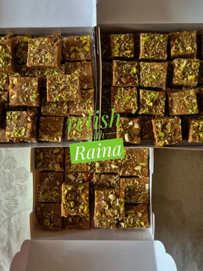 Three boxes of Adadiya Pak, a traditional Gujarati winter sweet. It's made with urad flour, ghee, dry fruits, and special adadiya masala to give warmth to the body during cold weather.