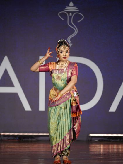 This dancer's elegant stance and focused expression are a testament to her training. She secured a 2nd place award in the senior category.