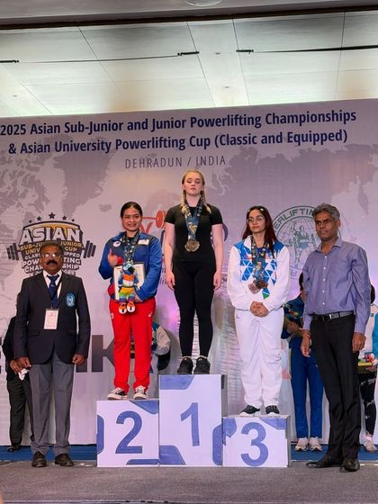 Priyanshi earning a bronze medal at her first international competition, the IPF Asian Junior Championship. She finished her junior career on a high note with a 122.5kg squat, 75kg bench, and 130kg deadlift.