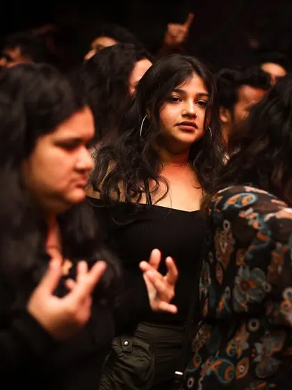 A candid shot of the diverse faces in the crowd, all connected by the music.