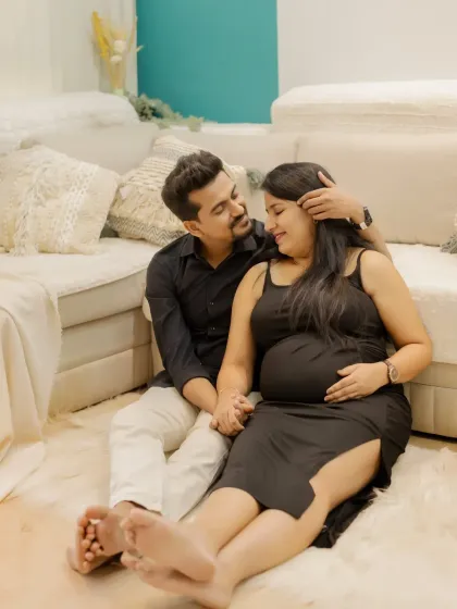 A sweet and relaxed portrait of you both. The genuine smiles and easy comfort with each other make this a truly special memory.