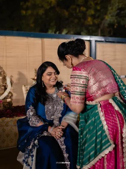 A candid moment from a Mameru ceremony. The bride-to-be is wearing a beautiful blue embroidered outfit, and the bindi is the perfect finishing touch that we couldn't get over.
