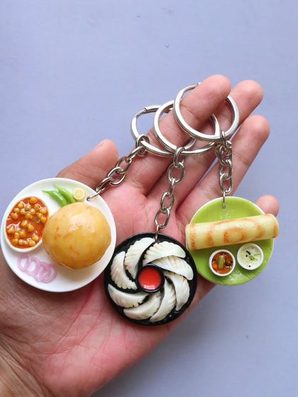 A handful of my most popular keychains: chole bhature, momos, and dosa.