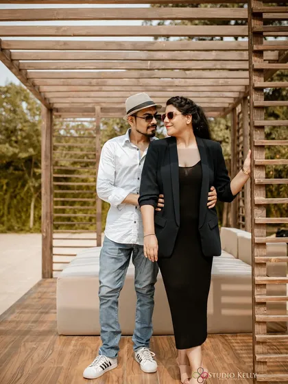 A stylish pre-wedding look. The makeup is sophisticated and polished, perfect for a modern couple's shoot.