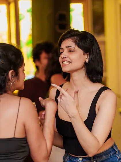 Friends chatting and laughing between songs. It's a social vibe as much as a dance party.