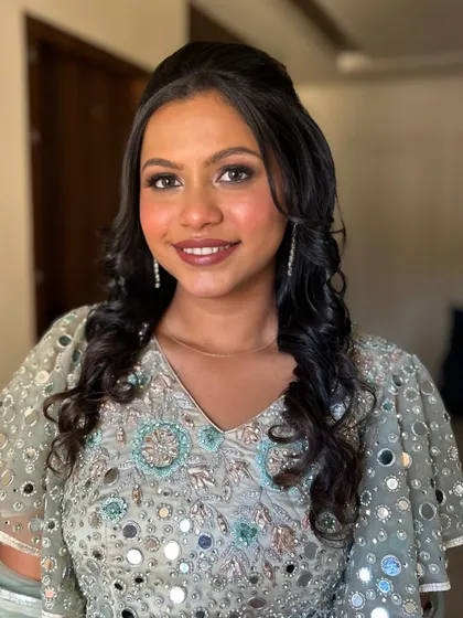 A full-face view showing the balanced and polished makeup, perfect for a wedding guest.