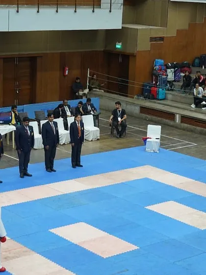 The opening ceremony of the All India University Karate Event, with officials and teams lined up. It is a formal start to a display of immense talent and hard work.