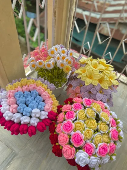 A collection of custom bouquets featuring roses, tulips, and daisies in vibrant color combinations.