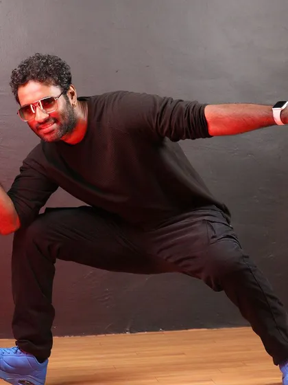 A dynamic pose from a photoshoot at the studio. I'm always ready to move and inspire.