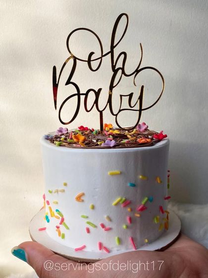This tiny "Oh Baby" cake is a sweet way to celebrate a new arrival or a baby shower. It's small, cute, and full of joy.
