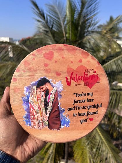 A Valentine's Day special, this round wooden artistic frame is UV printed with your photo and a custom message. It comes with a stand for easy display.