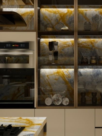 This shot details the built-in appliances and the smart storage solutions, including a pantry with illuminated glass-fronted cabinets.