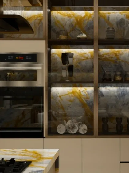 This shot details the built-in appliances and the smart storage solutions, including a pantry with illuminated glass-fronted cabinets.