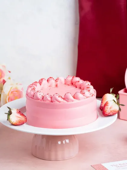 A lovely pink strawberry bento cake on a stand, perfect for a Valentine's Day promotion. We specialize in shooting these trendy and popular mini cakes.