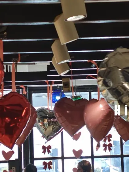 This image captures my team member making final adjustments to the hanging balloon display. I handle the entire setup process to ensure every detail is perfectly in place for your event or business opening.