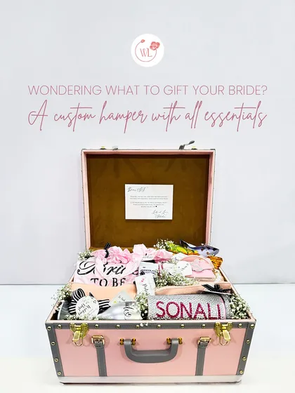 Every bride deserves to be pampered. This vintage-style trunk is filled to the brim with custom essentials, from personalized robes and tumblers to keepsakes, making it the ultimate 'bride-to-be' treasure chest.