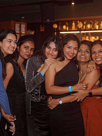 A candid shot of a group of friends having an amazing time on the dance floor. This is the energy I love to see.