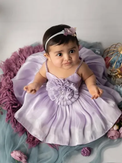 An overhead view of this lovely lavender-themed setup. This angle showcases the full arrangement and the baby's sweet, curious expression.