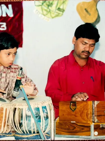 A childhood photograph with my father, who was my first teacher. He put me on the path of tabla, and I am forever grateful for his early guidance.
