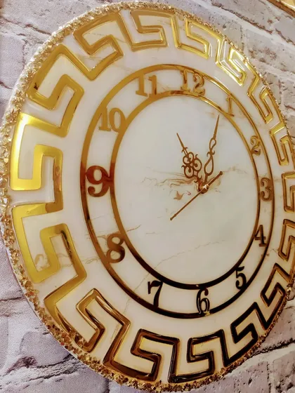 For those who love a touch of luxury, this gorgeous marble effect clock with a golden Versace-inspired design is a statement piece. It's handmade with love and ready to adorn a new wall.