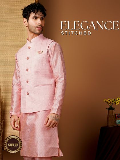 Elegance stitched. A pink textured Nehru jacket over a matching kurta, a great option for a daytime event.