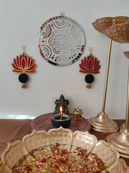 My Kamal (lotus) wall hangings are a symbol of purity and beauty. This pair in pink and black adds an elegant touch to any wall.
