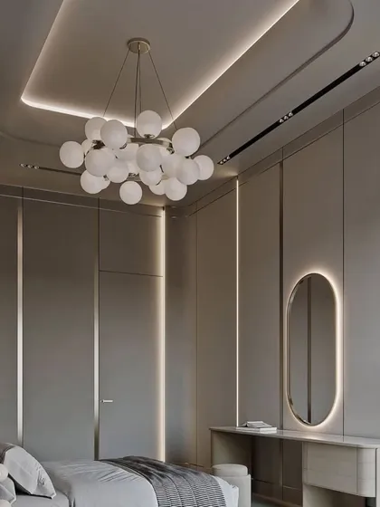 This angle shows the full layout of the bedroom, including the integrated wardrobe and the beautiful lighting design.