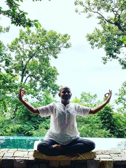 Here I am in a moment of quiet reflection in the Himalayas, practicing Jnana Mudra to open myself to knowledge and inner peace. I believe the environment we practice in becomes part of the practice itself, and the energy of these mountains is profoundly clarifying.