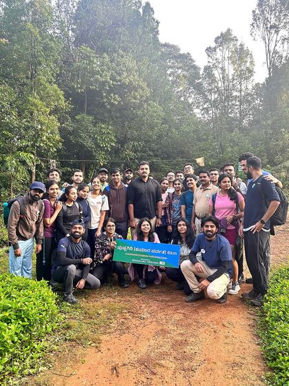 Our group with a banner from the forest department, supporting the plastic-free initiative on the Kumara Parvatha trail. We are committed to responsible trekking.