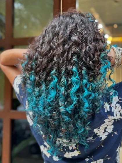 The vibrant turquoise tips from a different angle, showing how the color is woven through the ends.