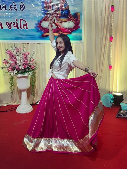 A dynamic pose captured during a performance at a cultural event.