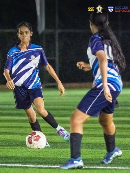 Nizh Kapadia in a one on one situation during a competitive match. We focus on developing players who are confident and decisive on the ball, especially in attacking scenarios.