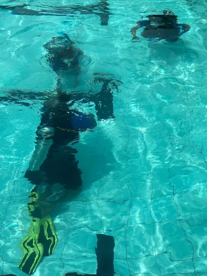 Practicing finning techniques and movement in the pool is a key part of the Open Water course, preparing you for efficient swimming in the ocean.