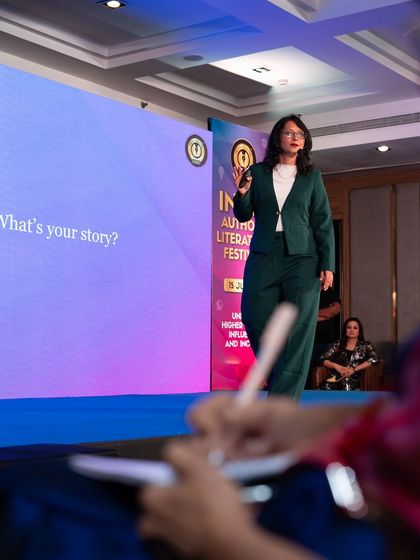 Speaking on stage at the India Authors Literature Festival. A coach can change everything. My mission is to be that mentor for others, helping them find their voice and purpose.