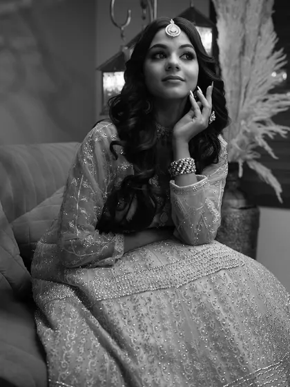 A black and white version of the portrait, which emphasizes the light, shadow, and texture of the outfit. This classic style adds a touch of artistic flair to a portfolio.