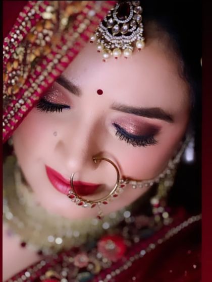 A close up shot of a bride's eye makeup, with a focus on the shimmer and the perfectly blended colors, framed by her veil.
