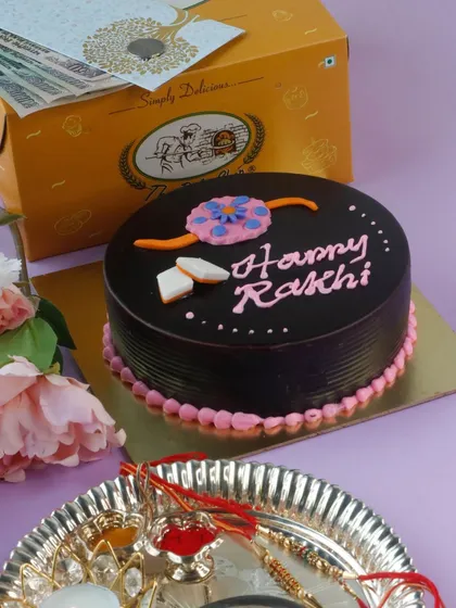 Celebrate the sibling bond with our Swiss Chocolate Rakhi Cake. This rich chocolate cake is decorated with a festive Rakhi design.