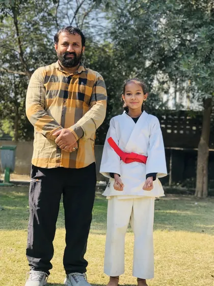 Another one of my dedicated female students after her red belt test. Her focus and spirit are commendable.