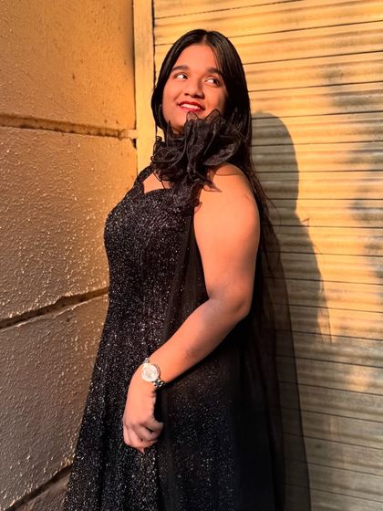 A simple yet stunning black shimmery gown. Sometimes, all you need is a little sparkle to make a statement.