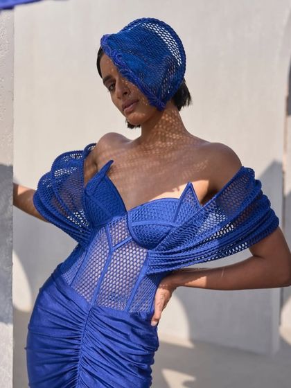 This active blue gown is defined by its sculpted mesh corset and ruched bottom, capturing the perfect balance of strength and fluidity. A masterpiece that refracts confidence.