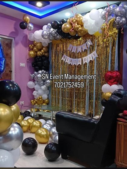 Another angle of the versatile black, gold, and silver home decoration. This shows how the setup can transform a living room into a stylish party space.